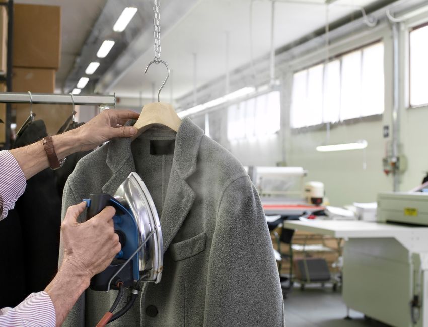 expert steam press for perfectly finished garments - Grand Power Cleaners