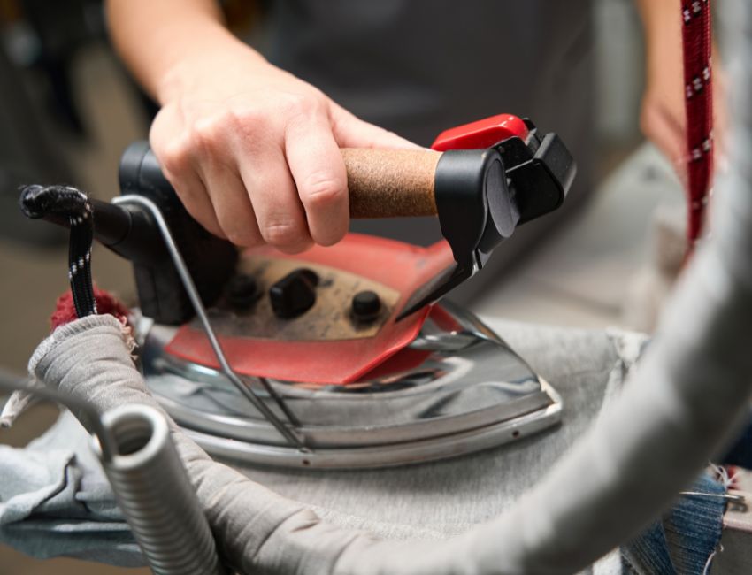 expert steam press for perfectly finished garments - Grand Power Cleaners